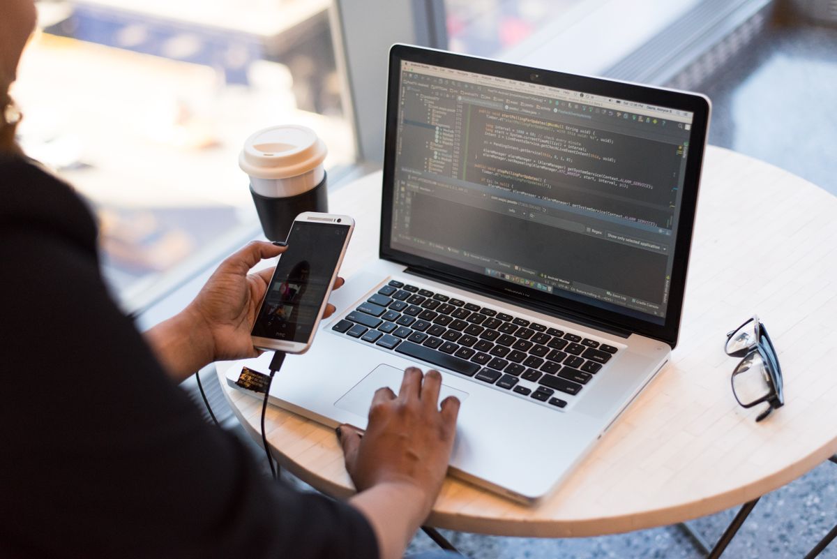 Laptop and phone used to test a website on two screens