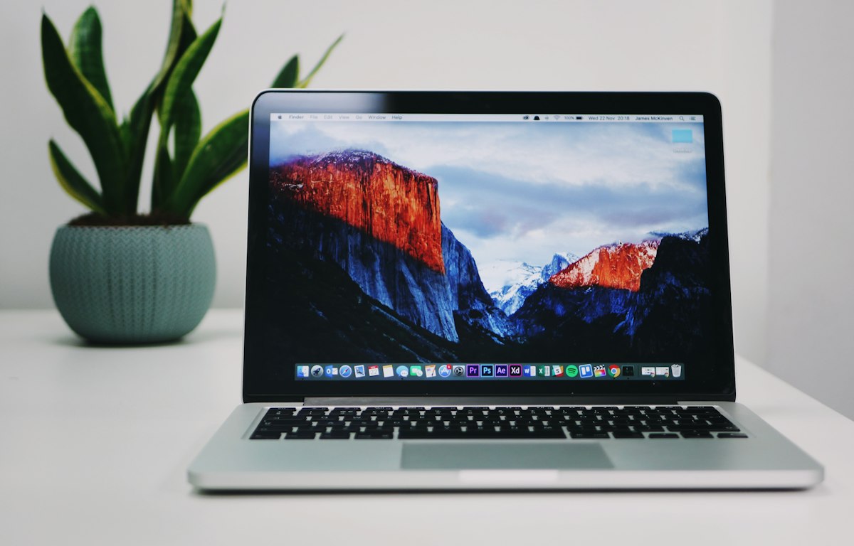 Open laptop on a clean desk ready for setting up a website