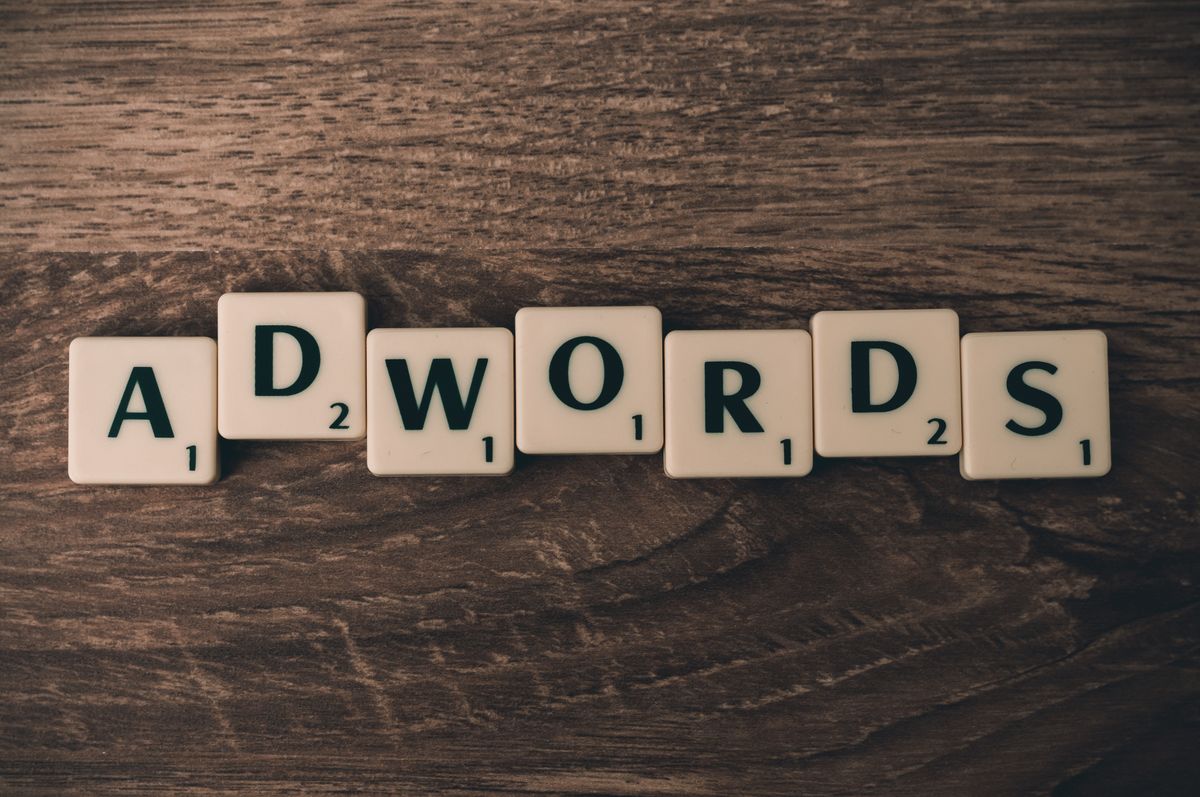 Wooden letter tiles spelling a word, like choosing a domain name